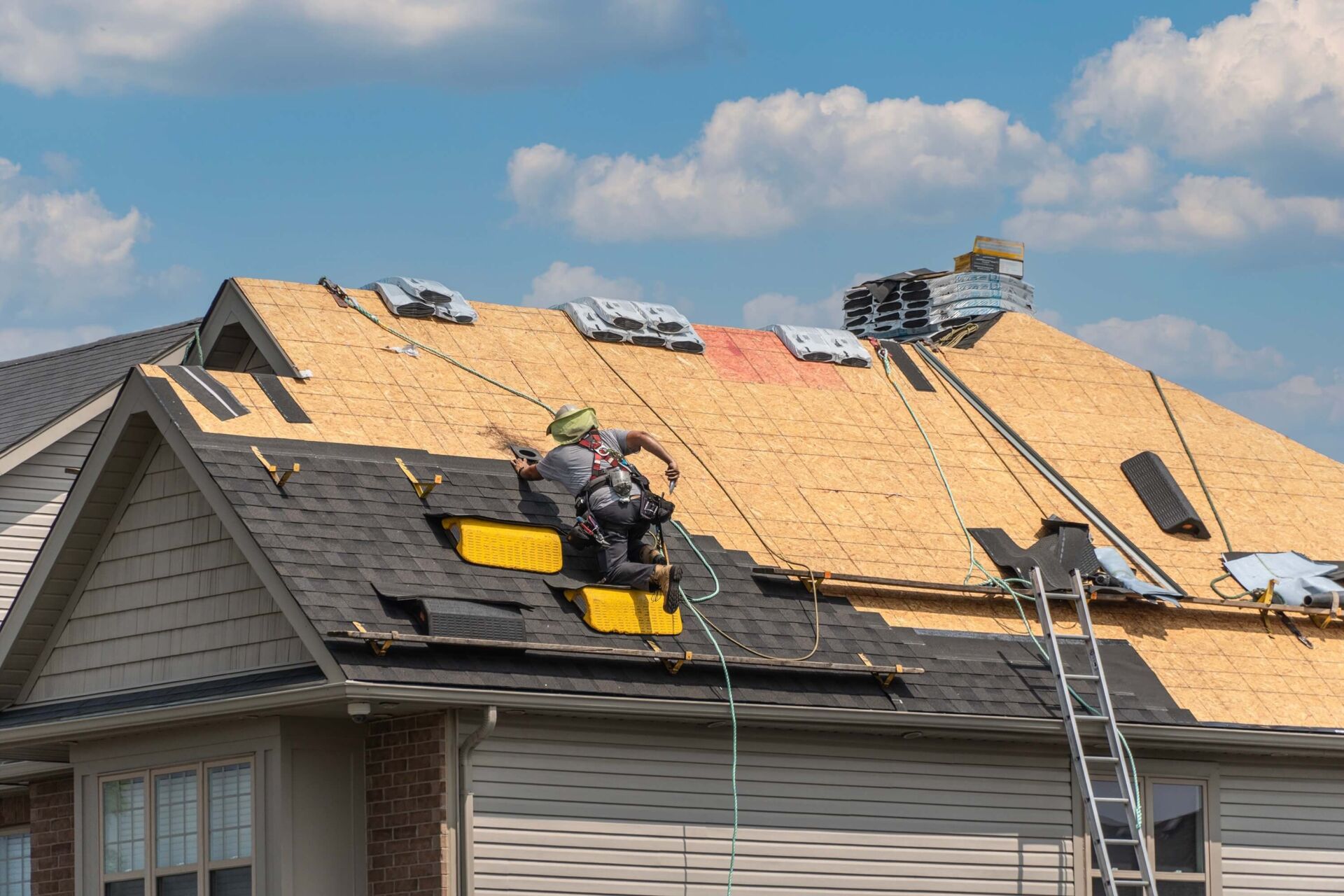 Toronto Roofing Specialists craftsman installing premium shingles